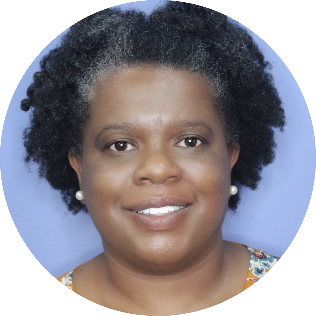 Alesha Lackey smiling with a blue background