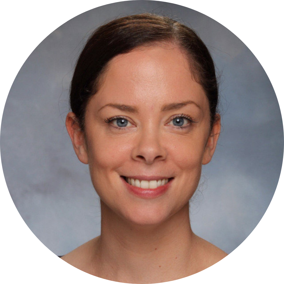 Christine Szeluga, a person with brown hair and blue eyes on a grey background