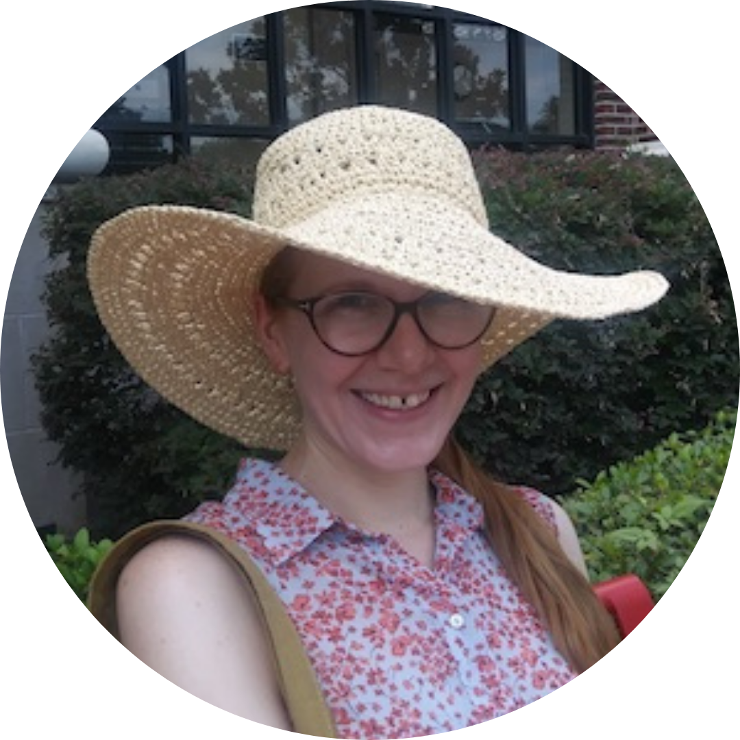 Jen Hoyer wearing a straw hat and a floral shirt