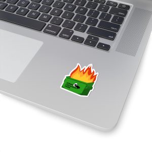 A small "Urban Librarians Unite" dumpster fire sticker applied to the palm rest of a silver MacBook laptop.